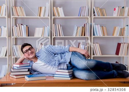 Young student taking break and falling asleep Young student taking break and falling asleep 32854308