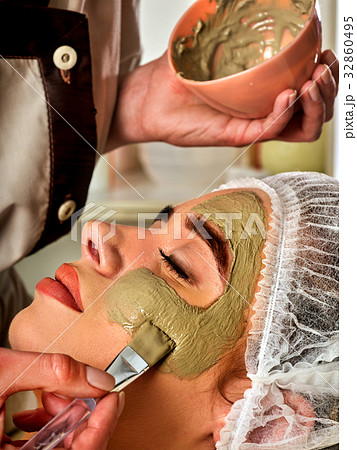 Mud facial mask of woman in spa salon. Face Mud facial mask of woman in spa salon. Face 32860495