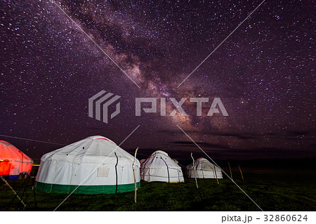 Group of yurts against the starry sky at night in 32860624