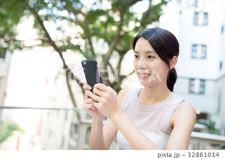Asian Woman use of phone Asian Woman use of phone 32861034