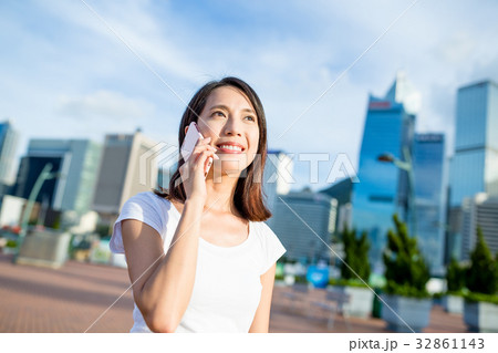 Woman talking on cellphone Woman talking on cellphone 32861143