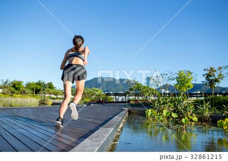 Woman running in outdoor park Woman running in outdoor park 32861215