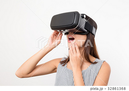 Woman looking with VR device and feeling excite 32861368