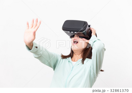 Woman feeling horrible with VR device Woman feeling horrible with VR device 32861370