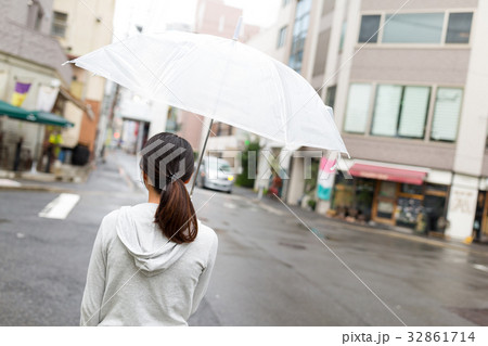 Back view of woman holding umbrella in Hiroshima city 32861714