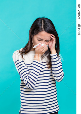 Woman feeling headache and sneezing Woman feeling headache and sneezing 32862186