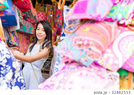 Woman buying colorful bag in weekend market 32862553