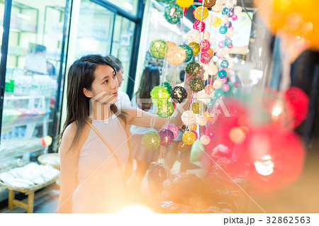 Woman shopping at decoration lantern in street market 32862563
