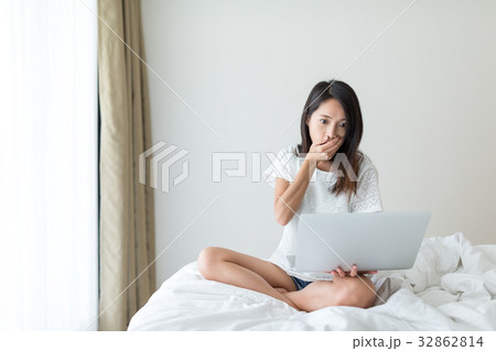 Woman feeling scary on laptop computer Woman feeling scary on laptop computer 32862814