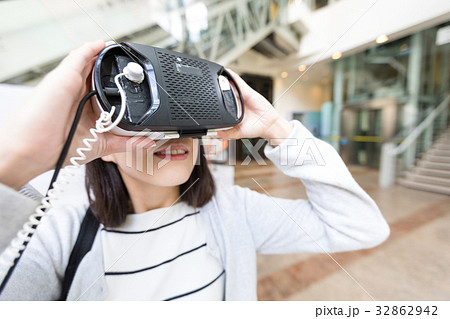 Woman looking with VR device Woman looking with VR device 32862942