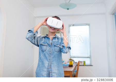 Woman wearing VR device Woman wearing VR device 32863006