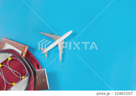 Toy plane is flying out of a travel backpacker. Toy plane is flying out of a travel backpacker. 32863107