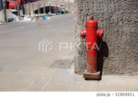 Old red fire hydrant in the street. Fire hidrant 32869851