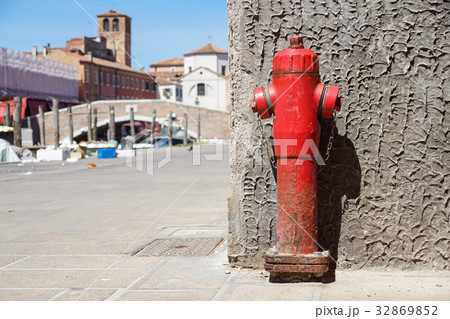 Old red fire hydrant in the street. Fire hidrant Old red fire hydrant in the street. Fire hidrant 32869852