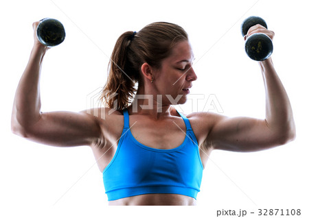 Strong muscular woman working out with weights 32871108