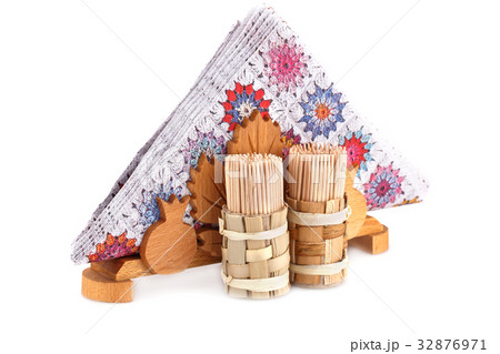 Paper napkins in holder and toothpicks Paper napkins in holder and toothpicks 32876971