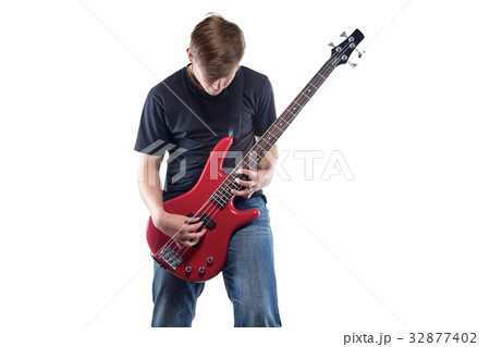 Teenage boy with bass guitar Teenage boy with bass guitar 32877402
