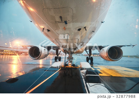 A busy airport in the rain A busy airport in the rain 32877988