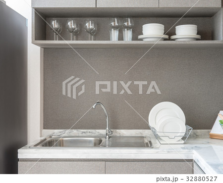 modern kitchen room with sink on granite counter 32880527