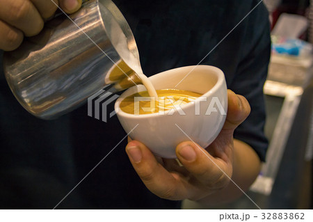 barista take the latte art in white mug barista take the latte art in white mug 32883862