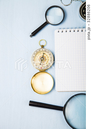 Compass, magnifying glass and  notebook 32886206