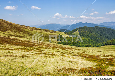 grassy hillsides on mountain ridge grassy hillsides on mountain ridge 32886889