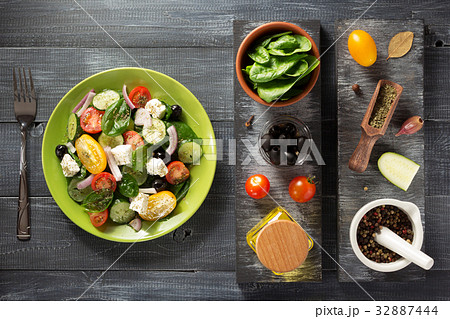 fresh greek salad in plate and ingredients fresh greek salad in plate and ingredients 32887444
