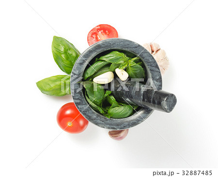 basil in mortar on white background 32887485