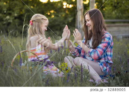 Beautiful girl on the meadow 32889005