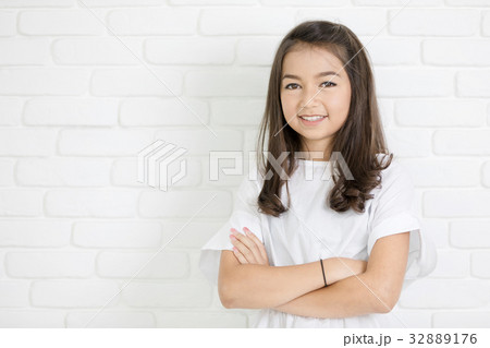 Headshot Portrait of happy cute girl smiling looking at camera. Headshot Portrait of happy cute girl smiling looking at camera. 32889176