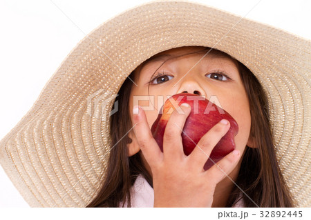 cute little girl, hand holding, biting red apple cute little girl, hand holding, biting red apple 32892445