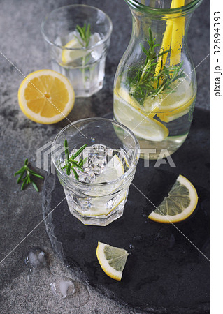 Detox water, lemonade with ice, lemon and rosemary Detox water, lemonade with ice, lemon and rosemary 32894393