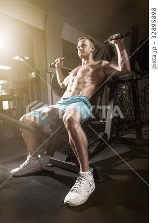 handsome fitness man weightlifting workout in gym handsome fitness man weightlifting workout in gym 32895898