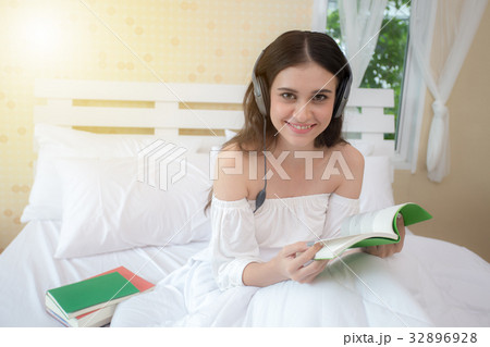 Beautiful young woman reading book. 32896928