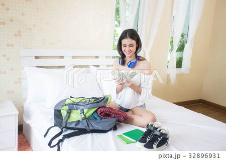 Beautiful young woman holding a lot of money Beautiful young woman holding a lot of money 32896931