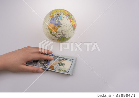 Human hand holding American dollars Human hand holding American dollars 32898471
