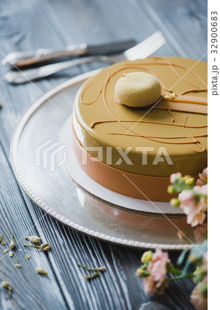 Bakery with piece of unusual yellow mousse cake Bakery with piece of unusual yellow mousse cake 32900683