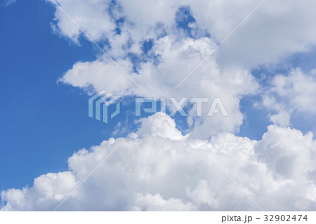 White clouds and bright blue sky background 32902474