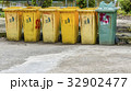 Yellow and green recycle bin trash bin in the park 32902477