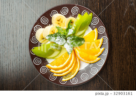 Vegan breakfast: variety of fruits, nuts and Vegan breakfast: variety of fruits, nuts and 32903161