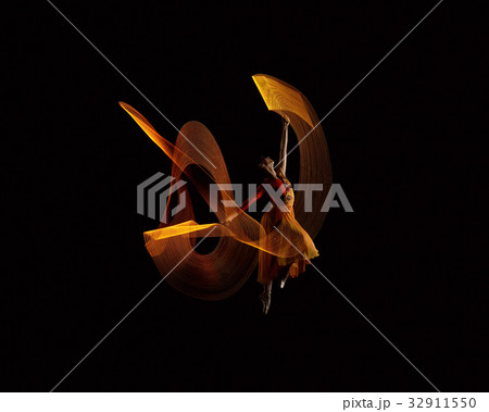 Beautiful ballerina dancing with lights effect 32911550