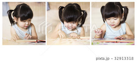 Charming and lovely asian kid concentrated Charming and lovely asian kid concentrated 32913318