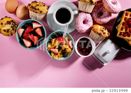 Tasty fresh breakfast food ingredients on pink Tasty fresh breakfast food ingredients on pink 32913499