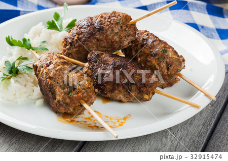 Barbecued kofta with rice on a plate 32915474