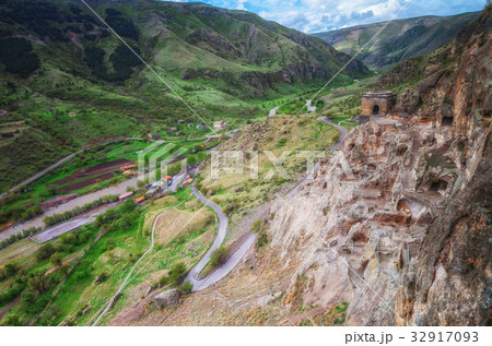 Tourists visiting Vardzia ancient cave city on a 32917093