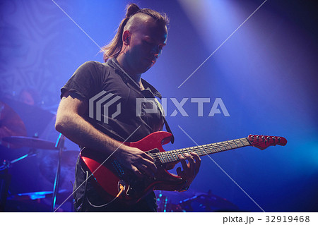 Guitarist performing on stage. Guitarist performing on stage. 32919468