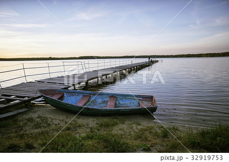 Landscape with a lake and boats. Landscape with a lake and boats. 32919753