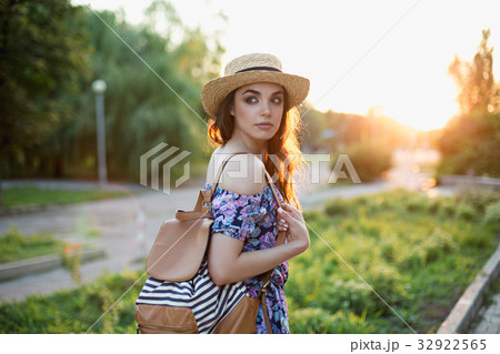 Attractive young woman enjoying her time outside Attractive young woman enjoying her time outside 32922565