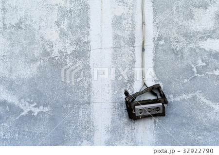 old broken electric socket on dirty cement wall fo 32922790