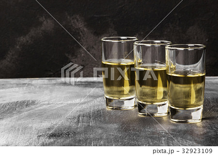 Tequila on a dark background. Copy space 32923109